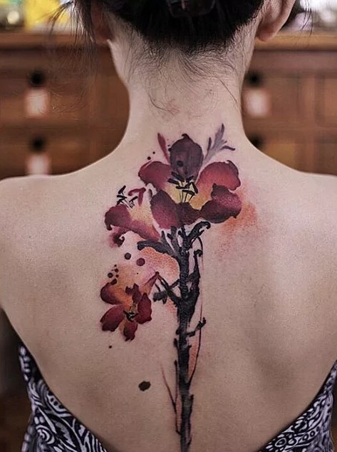 flower down spine tattoos for women