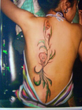 Lady With Flower Tattoo At The Back Art