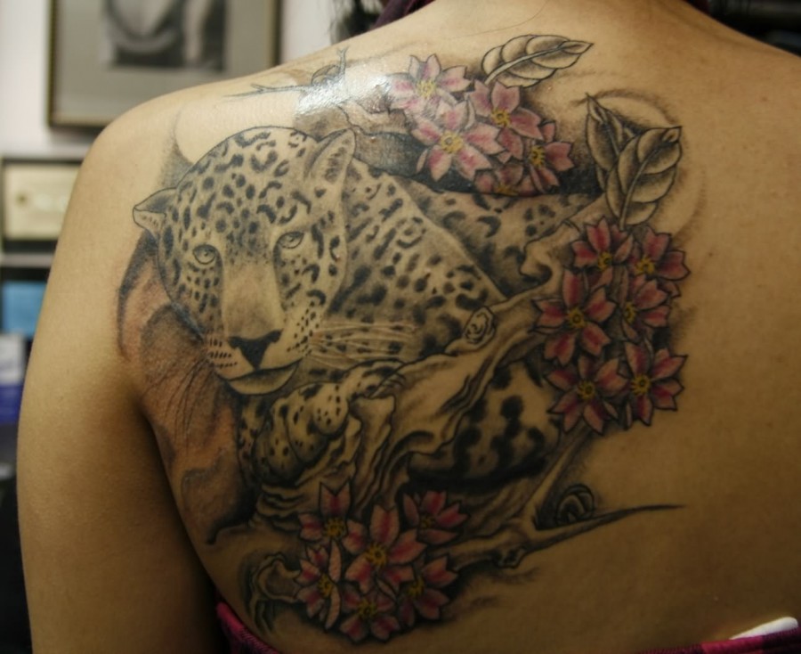 Leopard In Flowers Tattoo On Back