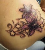 Nice Flowers And Stars Tattoo On Shoulder