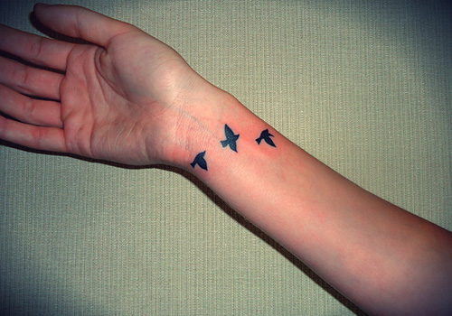 Cool Flying Bird Silhouette Arm Tattoo For Girls