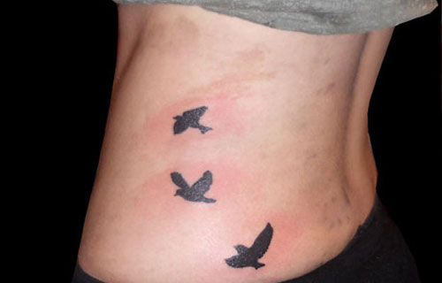 Lovely Flying Bird Silluoette Waist Tattoo Image For Girls