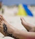 Bold Tribal Tattoo Design on Foot for men