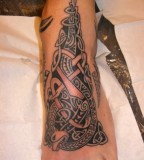 Awesome Tribal Tattoo Design On Foot