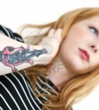 Girl's Forearm With Skeleton Tattoo