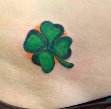 Green Four Leaf Clover Tattoo with Orange Background