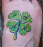Four Leaf Clover Leg Tattoo With Initial