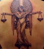 Fancy Libra Tattoo Design On The Upper Back