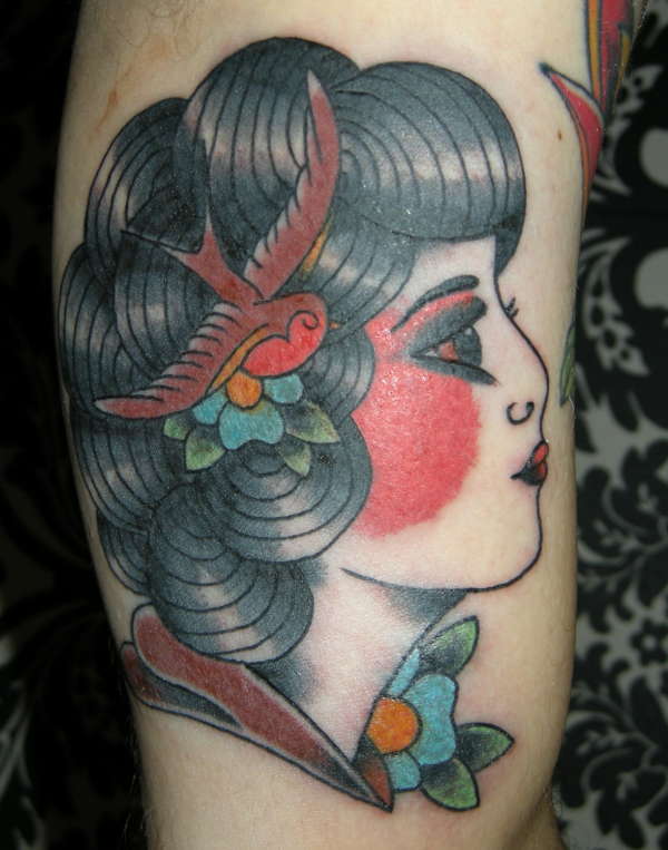 Gypsy Women with Black Curly Hair and Swallow Ornament Tattoos on Arm