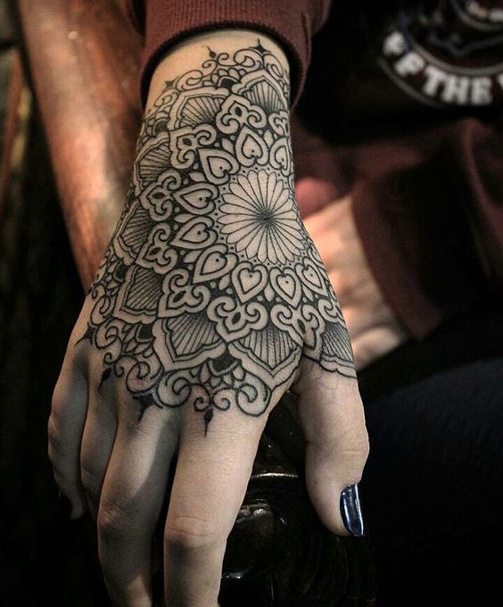 hand intricate mandala tattoo