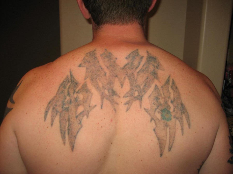 Healed White Ink Tattoo Design on Upper Back