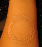 Circle Grain Symbol White Ink Tattoo