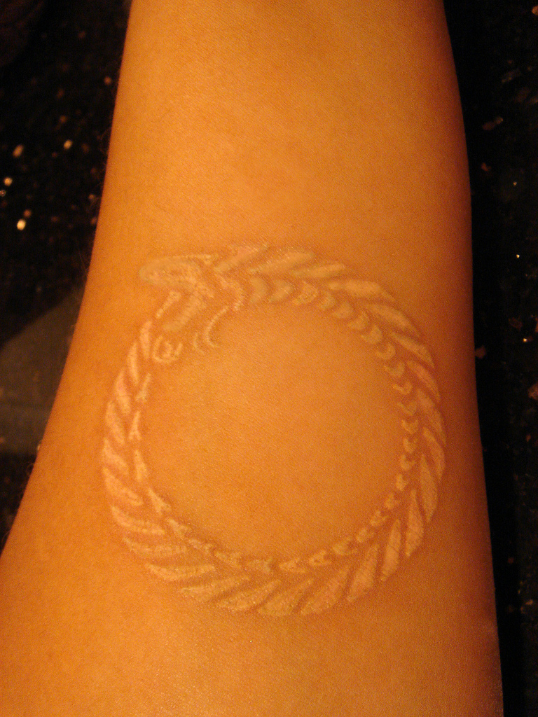 Circle Grain Symbol White Ink Tattoo