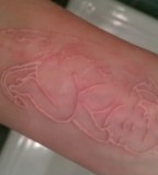 Baby Devil White Ink Tattoo