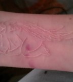 Baby Angel White Ink Tattoo on Forearm