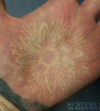 Sun Symbol White Ink Tattoo on Palm