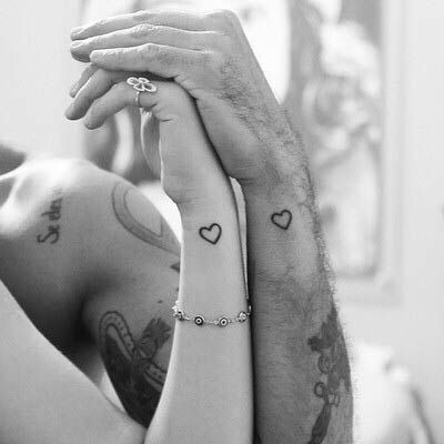 heart on wrist couples tattoos