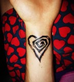 Circular Line Heart Design Tattoo On Wrist