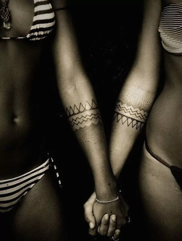 hers and hers symmetrical dotwork tattoo