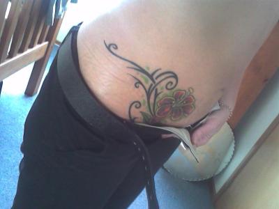 Wonderful Flower Tattoo Design on Hip for Girls