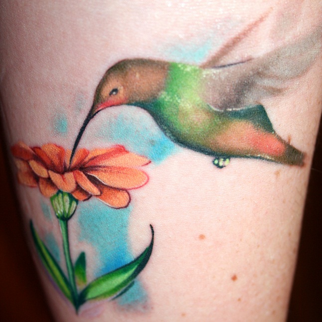 Tattoo Lovely Jasmine Flower In Orange With A Humming bird