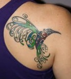 Curly Feather of Hummingbird Tattoo Design On Shoulder