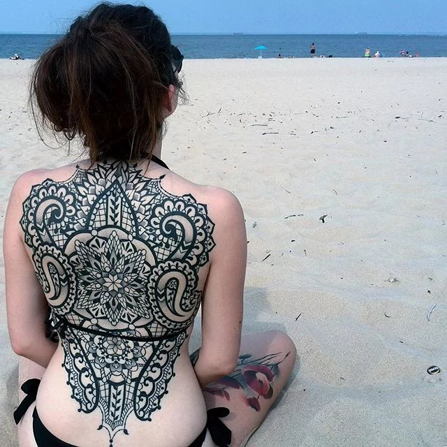 lace and tribal back tattoo