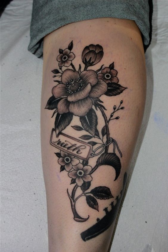 leg flower tattoo