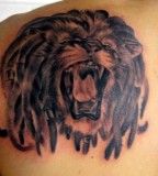 Deadly Lion Face Tattoo