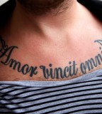 Awesome Amor Vincit Omnia Tattoo On Chest