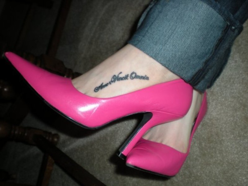 Sexy Latin Love Conquers All Tattoo On Foot