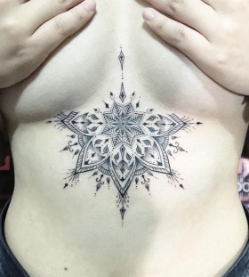 mandala-dotwork-style-sternum-tattoo