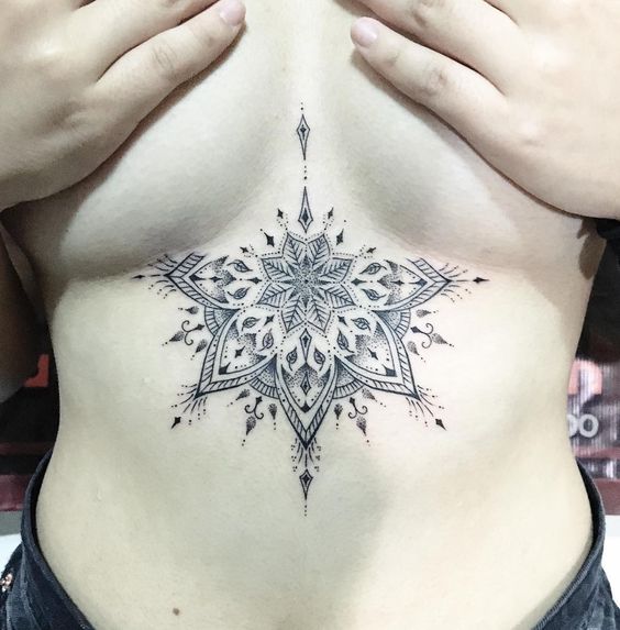 mandala-dotwork-style-sternum-tattoo
