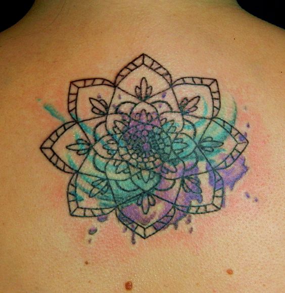 mandala style watercolor flower tattoo