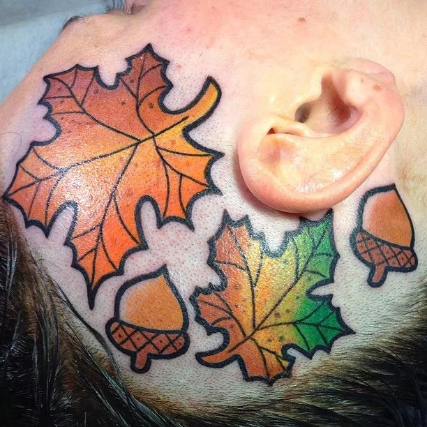 maple-leaf-and-acorn-hear-autumn-tattoo