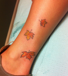 maple-leaves-on-leg-tattoo