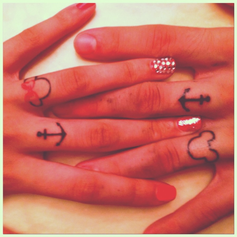 Matching Tattoos on Fingers for Couple