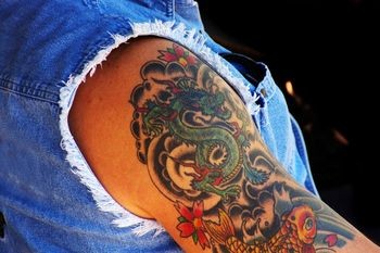 Beutiful Dragon and Koi Fish Upper-Arm Tattoo Design for Women