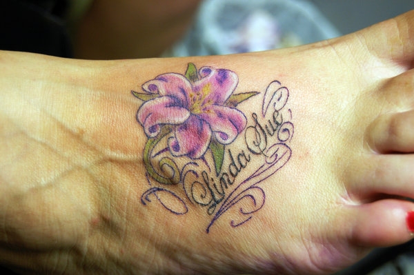 Sweet Lily With Lettering Tattoo Design