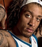 Face / Lettering Tattoo On Arm - Michael Beasley 