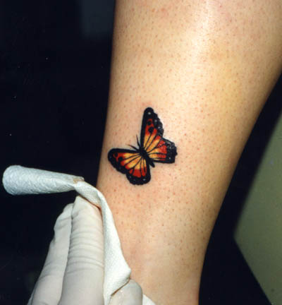 Cute Orange-Winged Monarch Butterfly Leg Tattoos – Butterfly Tattoos