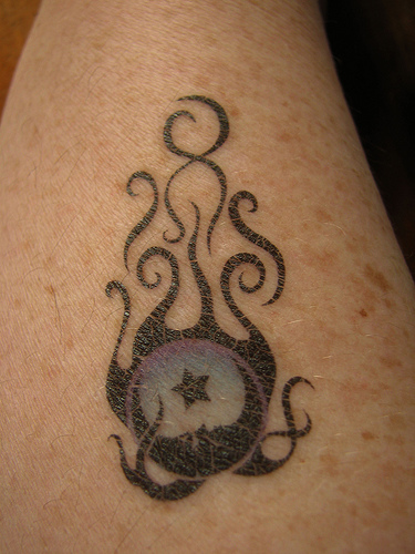 Cool Flaming Moon And Star Tattoo Design