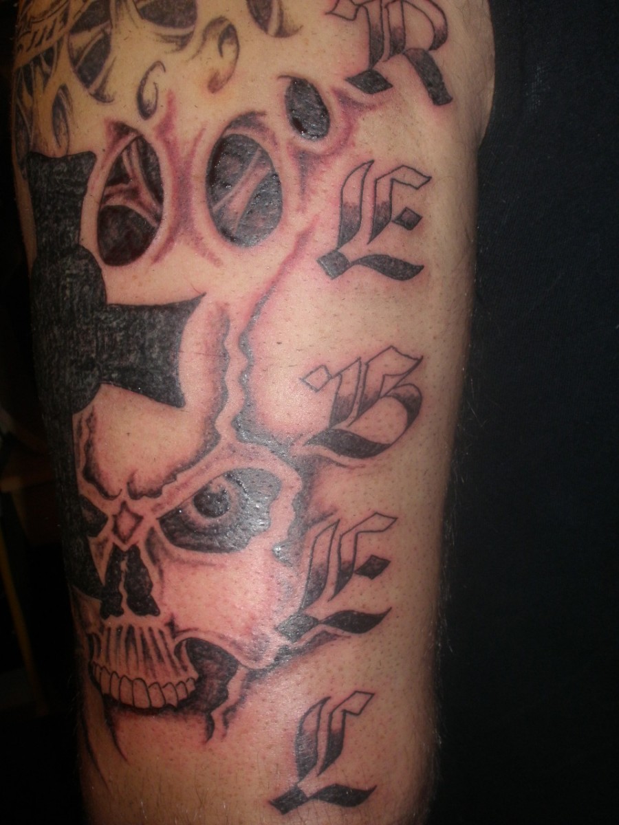 Skull and Cross Tattoo Design on Arm for Men