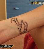 Daughters Name And Stars On Wrist Female Tattoo