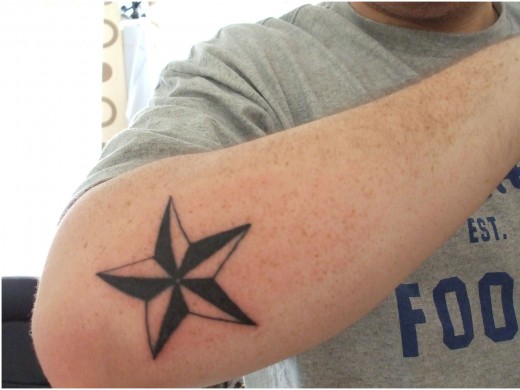 Simple Nautical Star Elbow Tattoo For Boy