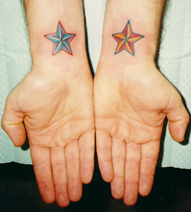 Red and Blue Stars Tattoo on Wrist