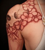 Beautiful & Sensational Girl Shoulder Tattoos of Flowers and Skull Tattoo Design