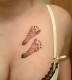 Cute Baby Footprint Chest Tattoo for Women (NSFW)