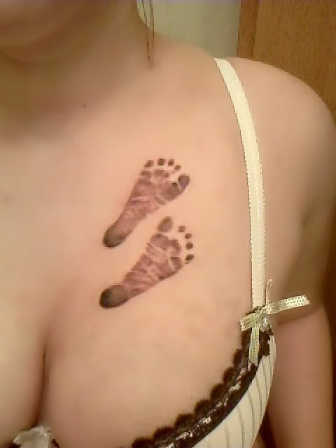 Cute Baby Footprint Chest Tattoo for Women (NSFW)