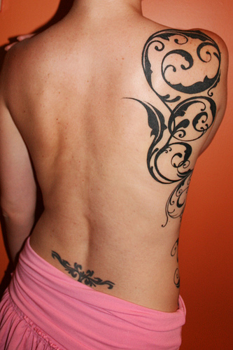 Swirls Rib and Lower-back Tattoo Designs for Women (NSFW)